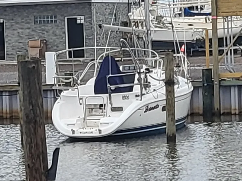 Slide: The Image of 1998 Hunter 280 sailboat docked in a marina. - 6