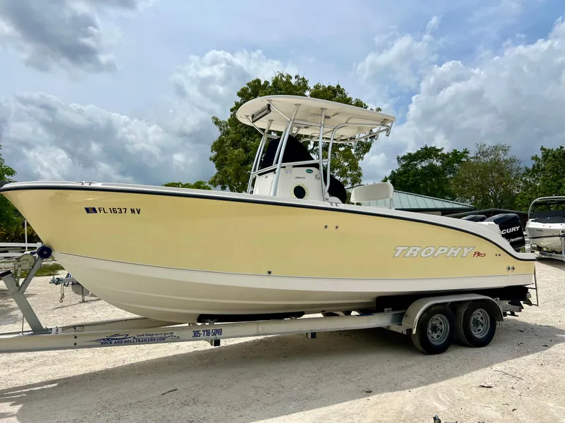 Slide: The Image of 2008 Trophy 2503 boat on trailer, side view, outdoors. - 1