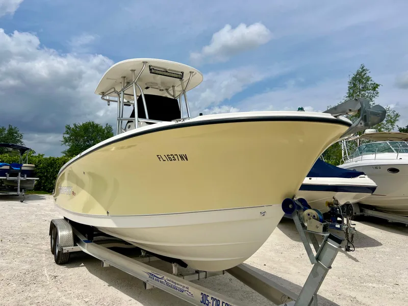 Slide: The Image of 2008 Trophy 2503 boat on trailer under cloudy sky. - 10