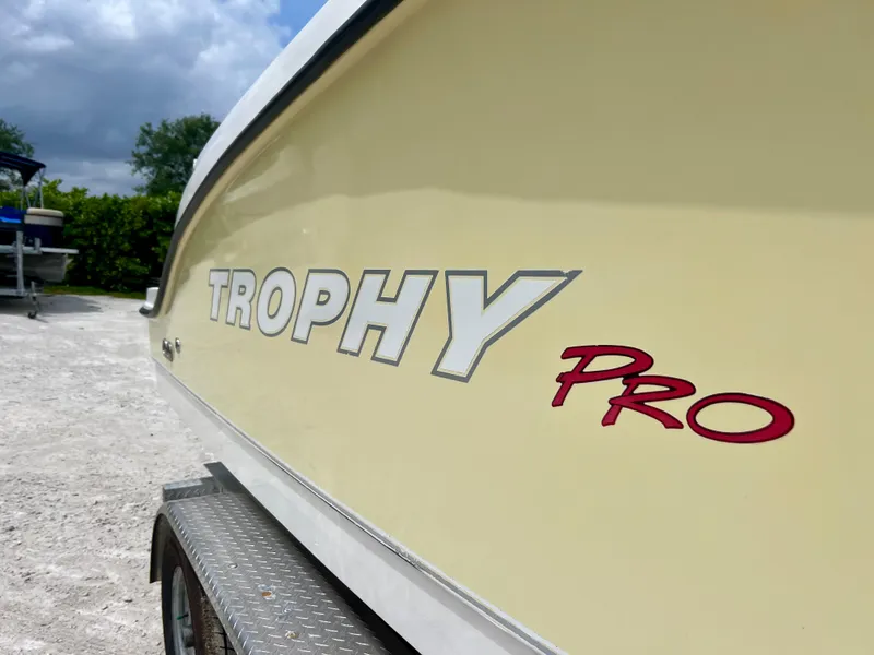 Slide: The Image of 2008 Trophy 2503 Pro boat side view with logo. - 12