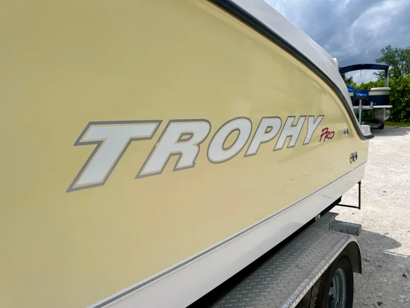 Slide: The Image of 2008 Trophy 2503 Pro boat side view on trailer. - 13