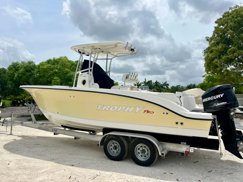 Slide: The Image of 2008 Trophy 2503 boat on a trailer with Mercury outboard motor. - 14