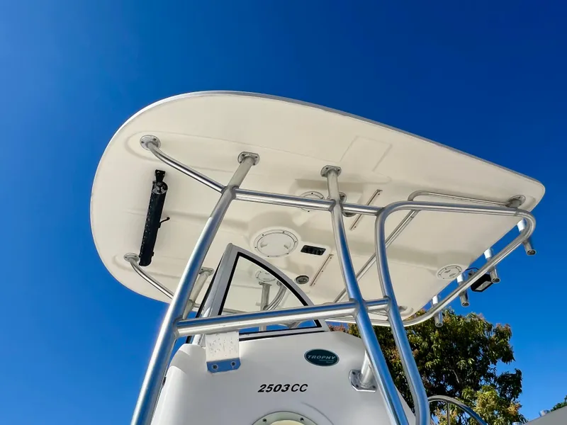 Slide: The Image of 2008 Trophy 2503 boat with T-top against clear blue sky. - 17