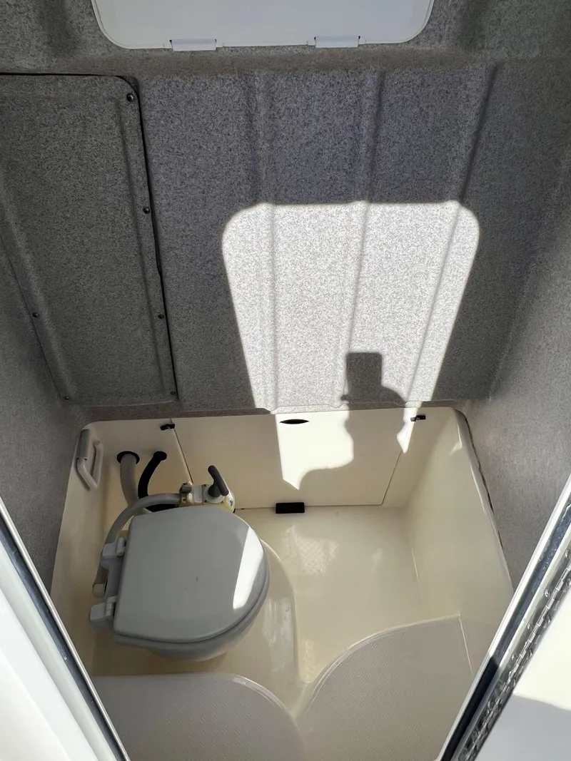 Slide: The Image of 2008 Trophy 2503 boat interior with compact marine toilet. - 22