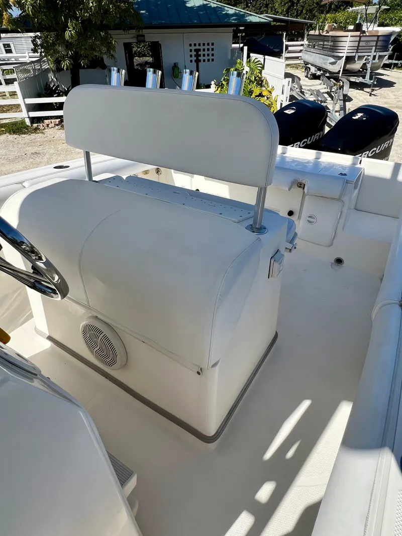 Slide: The Image of 2008 Trophy 2503 boat interior with seating and dual Mercury outboard engines. - 26