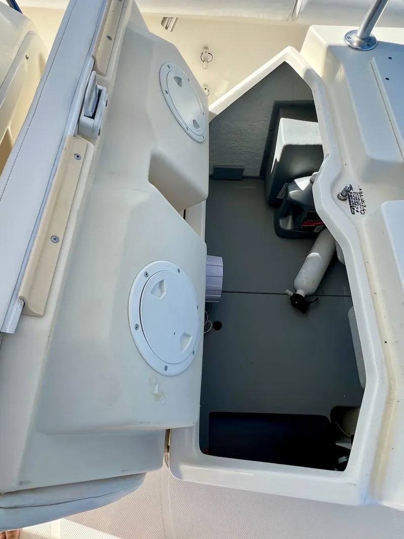 Slide: The Image of 2008 Trophy 2503 boat storage compartments and seating area. - 29