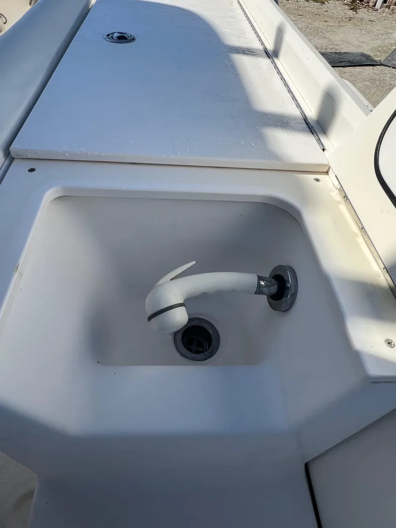 Slide: The Image of 2008 Trophy 2503 boat sink and faucet on deck. - 31