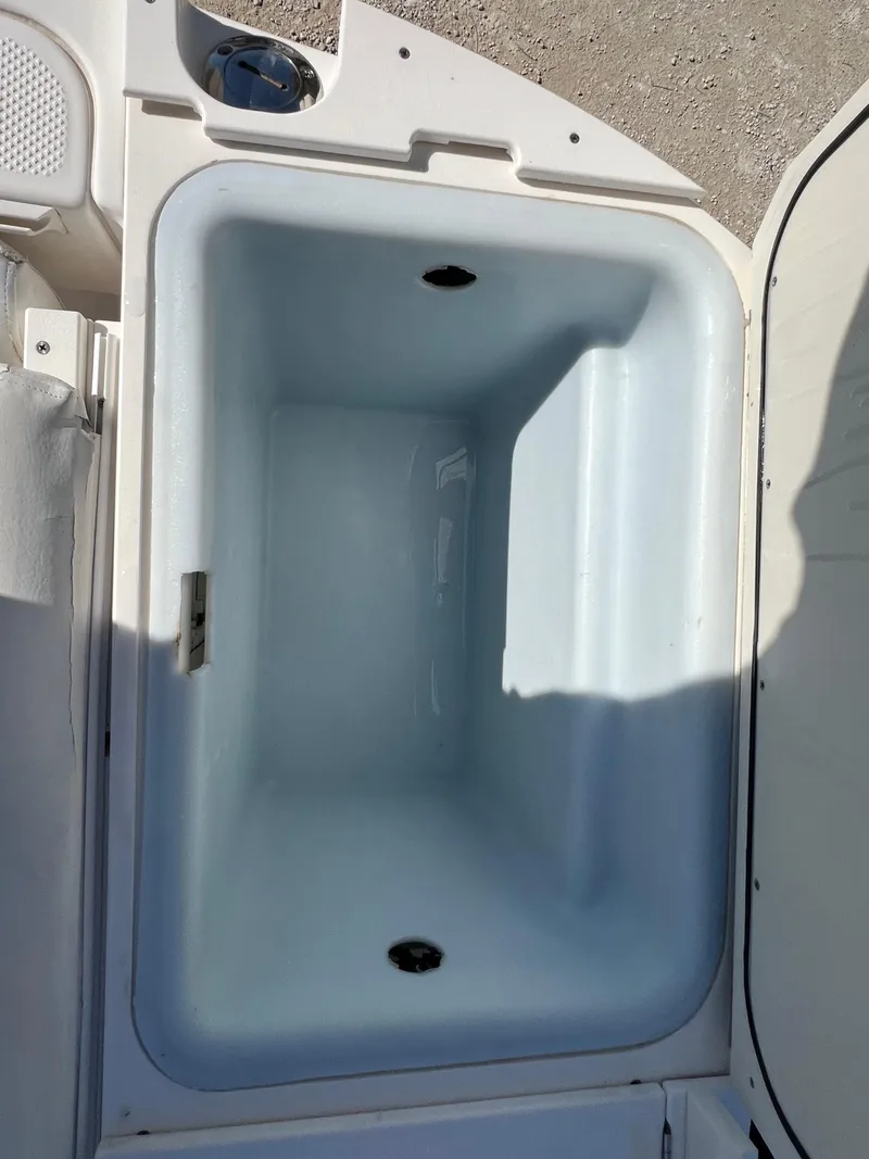 Slide: The Image of Open storage compartment on a 2008 Trophy 2503 boat. - 32
