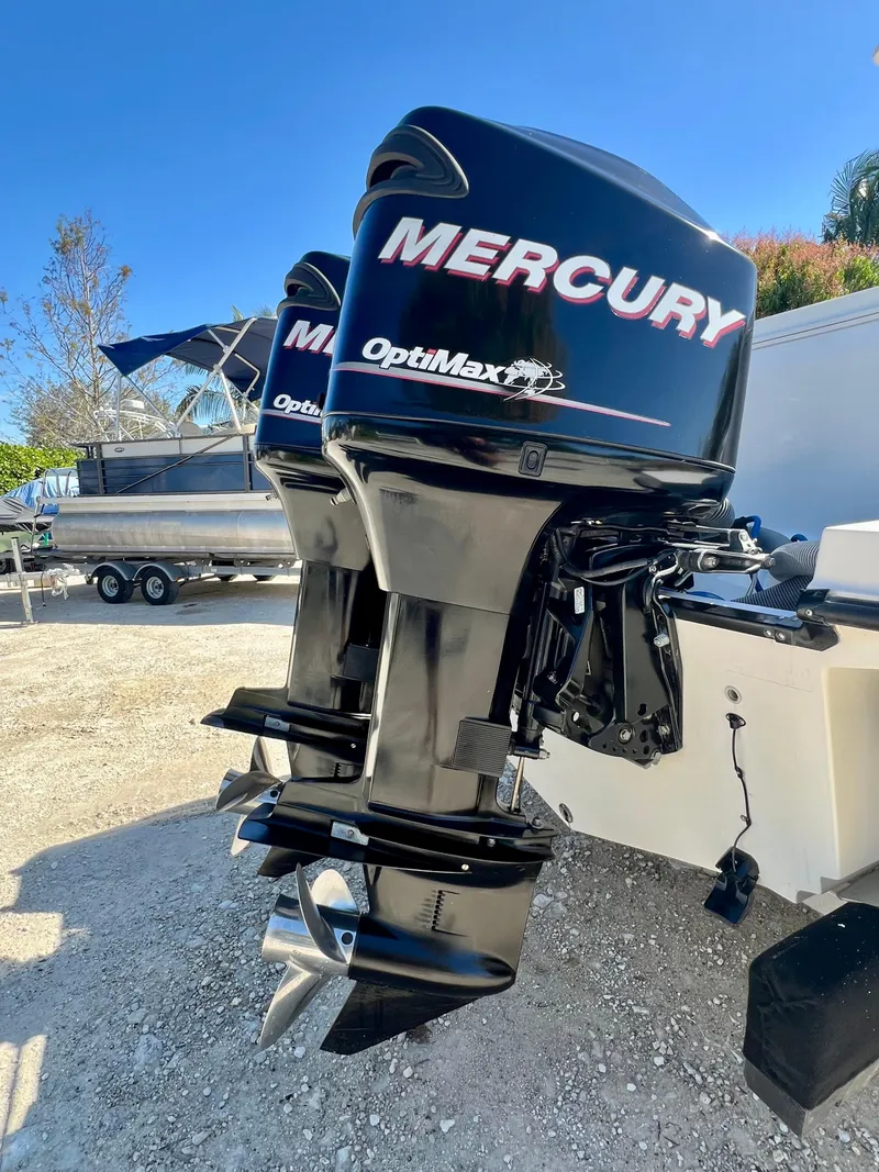Slide: The Image of Twin Mercury OptiMax outboard motors on a 2008 Trophy 2503 boat. - 37