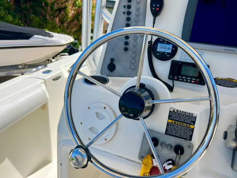 Slide: The Image of 2008 Trophy 2503 boat steering wheel and control panel. - 38