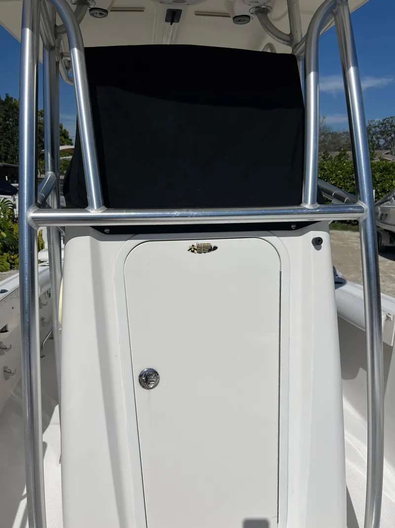 Slide: The Image of 2008 Trophy 2503 center console boat with T-top and storage compartment. - 49