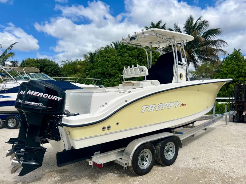 Slide: The Image of 2008 Trophy 2503 boat on trailer with Mercury outboard motor. - 7