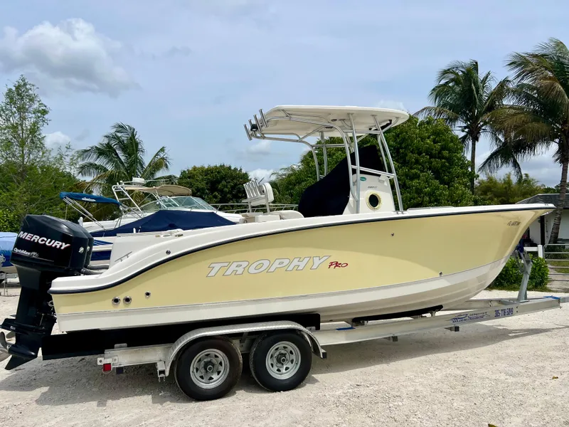 Slide: The Image of 2008 Trophy 2503 boat on trailer with Mercury outboard motor. - 8