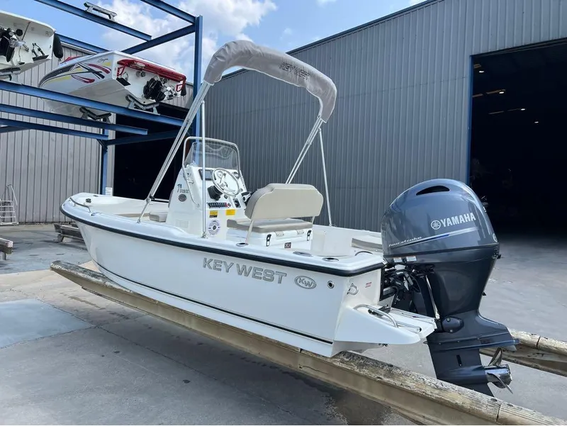 Slide: The Image of 2024 Key West 1720 CC boat with Yamaha engine in a marina setting. - 10