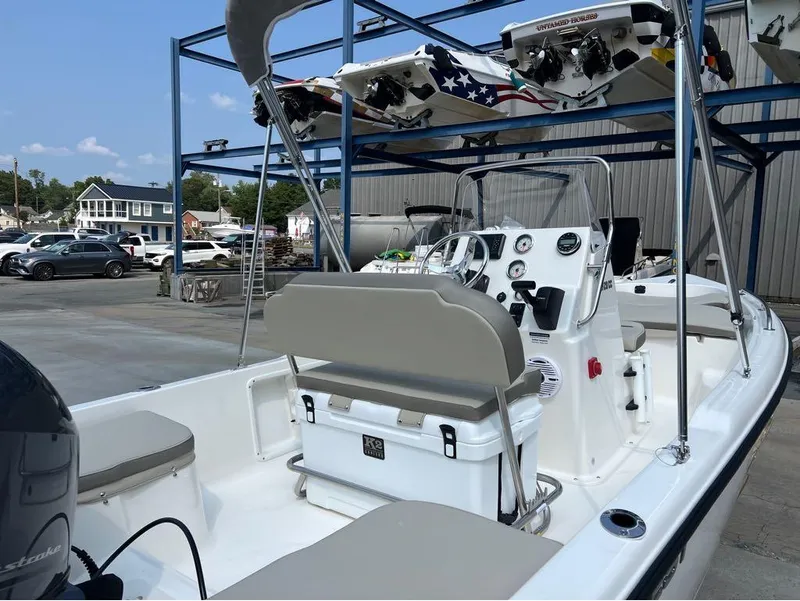 Slide: The Image of 2024 Key West 1720 CC boat in marina, featuring sleek design and modern controls. - 14