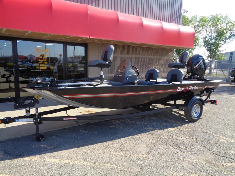 Slide: The Image of 2024 Tracker Bass Tracker Classic XL boat on trailer outside dealership. - 2