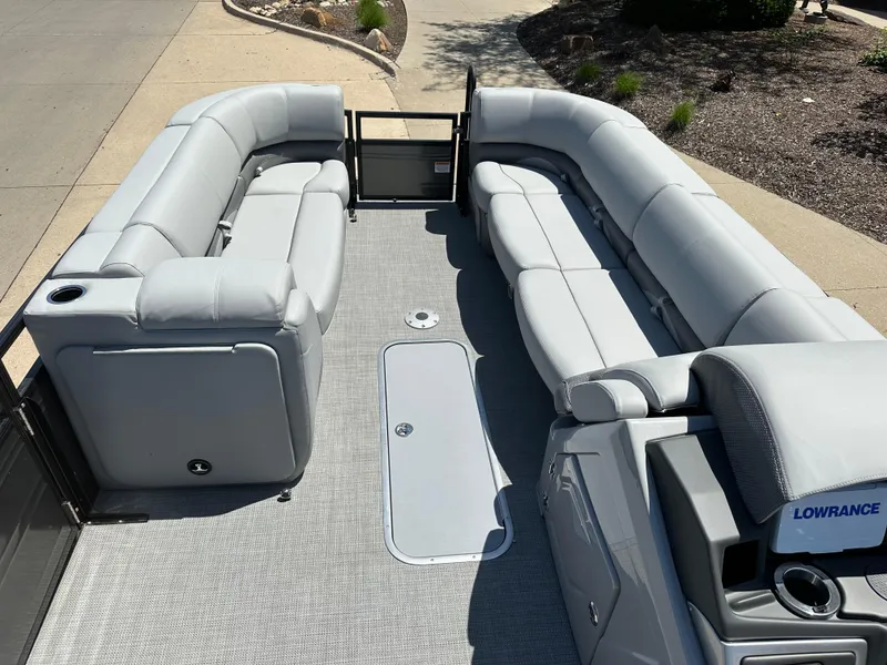 Slide: The Image of 2024 Regency 250 DL3 pontoon boat with spacious seating and modern design. - 3
