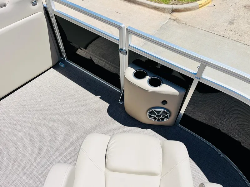 Slide: The Image of 2024 Sun Tracker SportFish 20 DLX boat interior with seating and cup holders. - 16