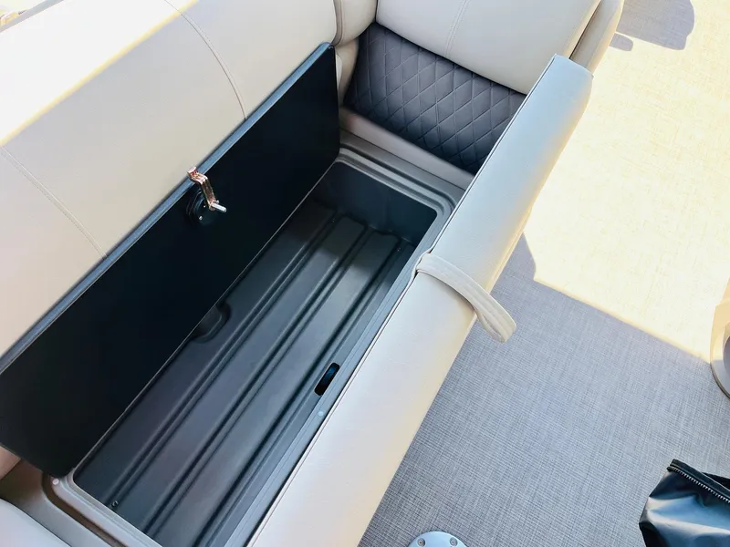 Slide: The Image of 2024 Sun Tracker SportFish 20 DLX boat seat storage compartment, open and empty. - 27