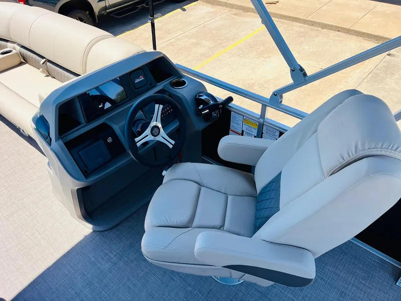 Slide: The Image of 2024 Sun Tracker SportFish 20 DLX boat interior with steering console and captain's chair. - 30