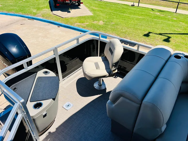 Slide: The Image of 2024 Sun Tracker SportFish 20 DLX pontoon boat interior with seating and fishing area. - 37
