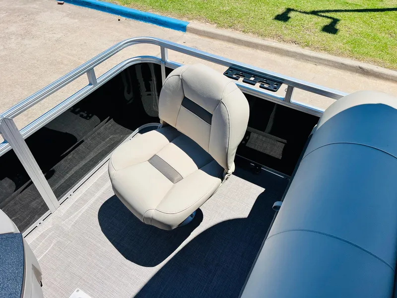 Slide: The Image of 2024 Sun Tracker SportFish 20 DLX boat seat, gray upholstery, outdoor setting. - 40