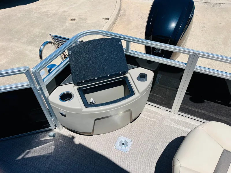 Slide: The Image of 2024 Sun Tracker SportFish 20 DLX boat interior with open storage compartment. - 41