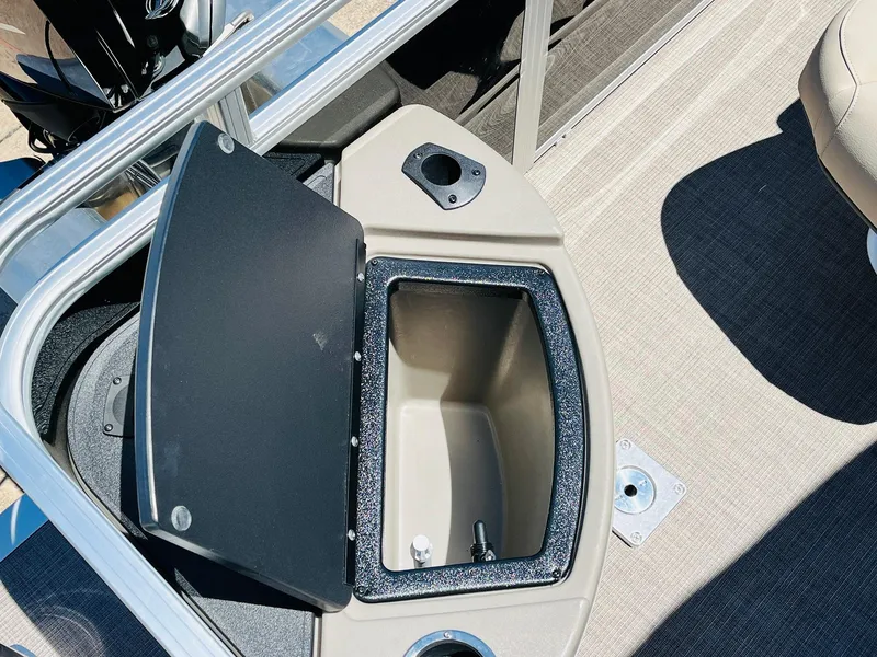 Slide: The Image of 2024 Sun Tracker SportFish 20 DLX boat storage compartment with open lid. - 42