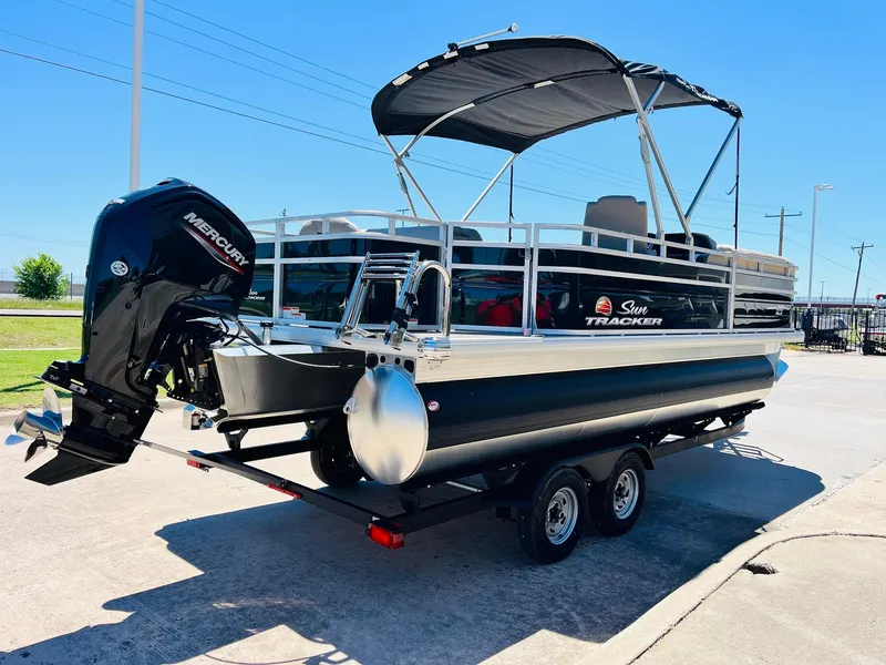 Slide: The Image of 2024 Sun Tracker SportFish 20 DLX pontoon boat with Mercury outboard engine on trailer. - 5