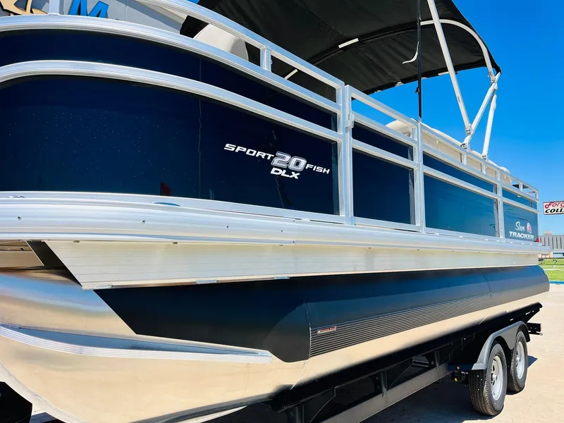 Slide: The Image of 2024 Sun Tracker SportFish 20 DLX pontoon boat on trailer, side view. - 9