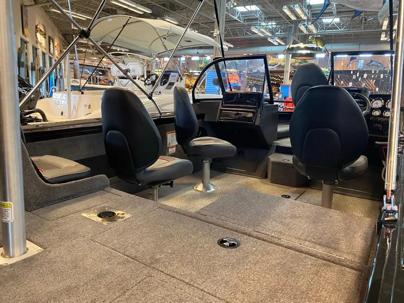 Slide: The Image of 2024 Tracker Targa V-18 Combo boat interior with seating and dashboard. - 4