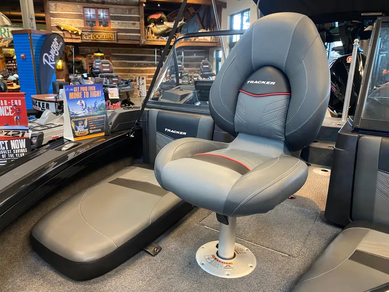 Slide: The Image of 2024 Tracker Targa V-18 Combo boat interior with gray seating and modern design. - 5