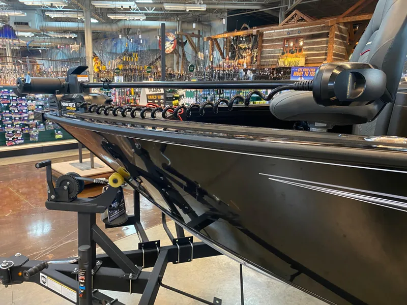 Slide: The Image of 2024 Tracker Targa V-18 Combo boat displayed in a showroom setting. - 6