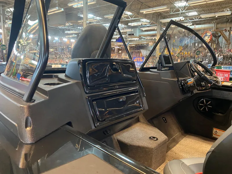 Slide: The Image of 2024 Tracker Targa V-18 Combo boat interior with modern dashboard and seating. - 8