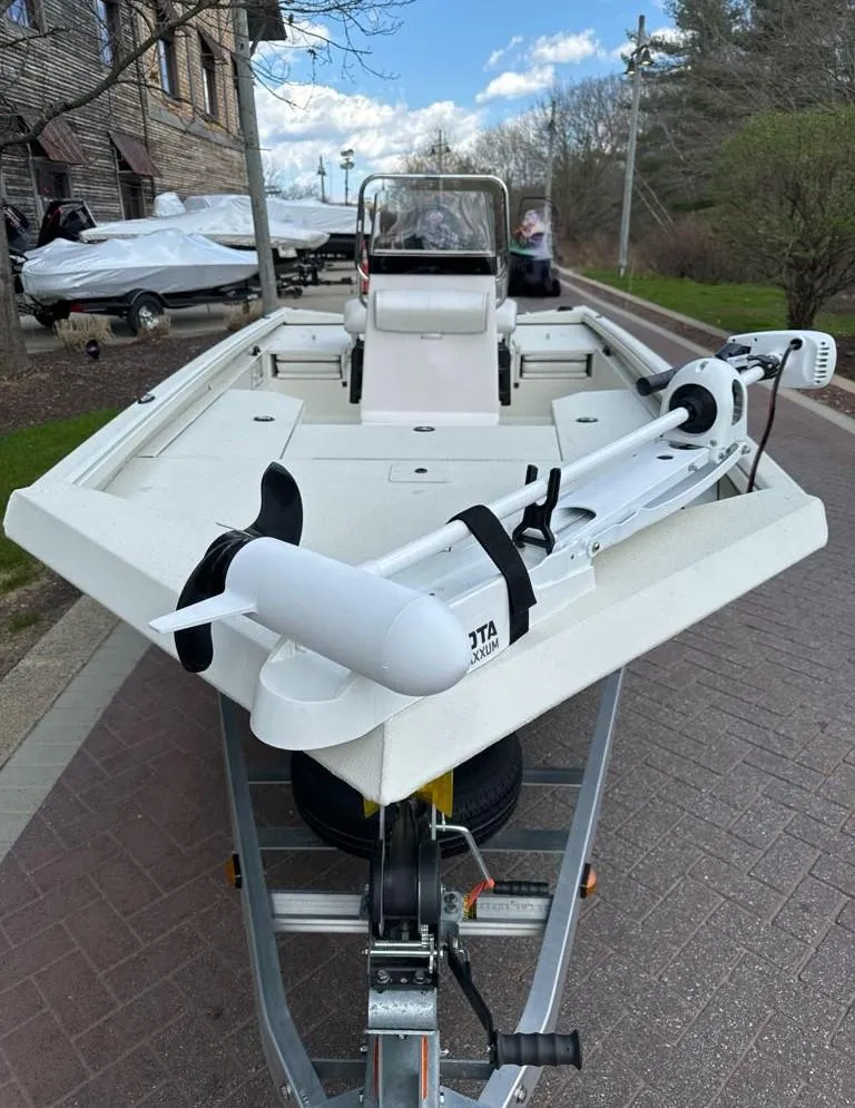 Slide: The Image of 2024 Ranger RB190 boat on trailer, equipped with trolling motor. - 2