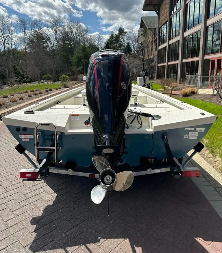 Slide: The Image of 2024 Ranger RB190 boat on trailer, rear view with outboard motor. - 3