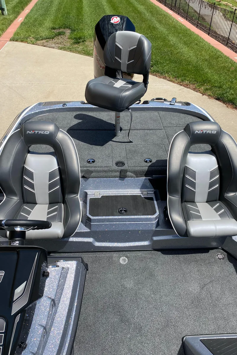 Slide: The Image of 2024 Nitro Z19 boat interior with three seats and modern design. - 5