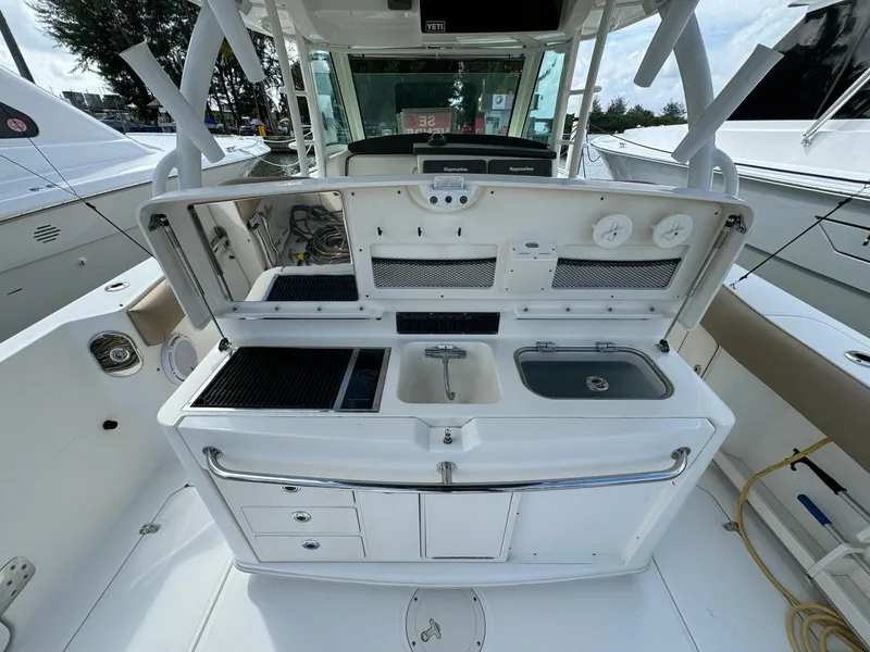 Slide: The Image of 2010 Boston Whaler 370 Outrage boat with onboard kitchen and sink area. - 10