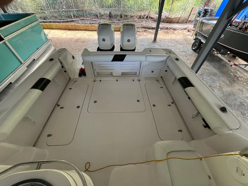 Slide: The Image of 2005 Pro-Line 32 Express boat interior with spacious deck and seating. - 6