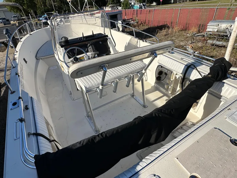 Slide: The Image of 1991 Pro-Line 210 boat interior with seating and steering console. - 5