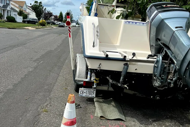 Slide: The Image of 2005 Key West 2300 WA boat parked on a residential street. - 4