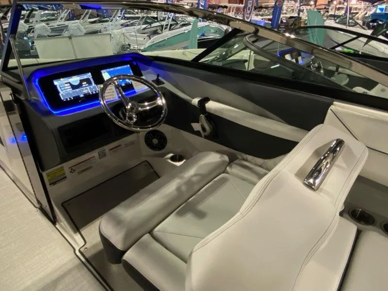 Slide: The Image of 2025 Regal LX4 boat cockpit with modern dashboard and steering wheel. - 4