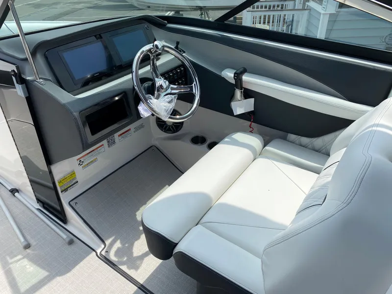Slide: The Image of 2025 Regal LX4 boat interior with modern dashboard and plush seating. - 5