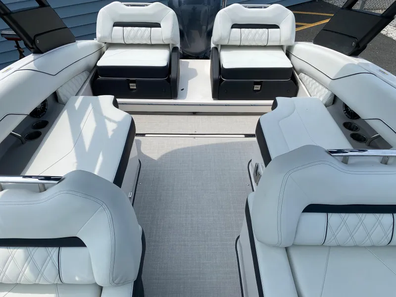 Slide: The Image of Luxurious 2025 Regal LX4 boat interior with white leather seating and modern design. - 8