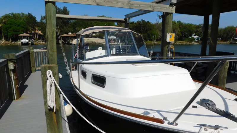 Slide: The Image of 2005 Legacy Yachts 28 Express docked at a marina. - 1