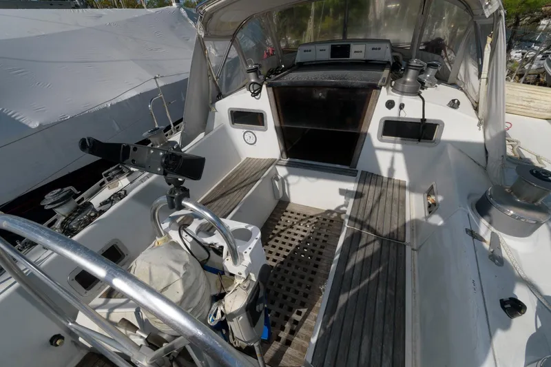 Slide: The Image of 1985 Beneteau 42 First sailboat cockpit with steering wheel and navigation equipment. - 21
