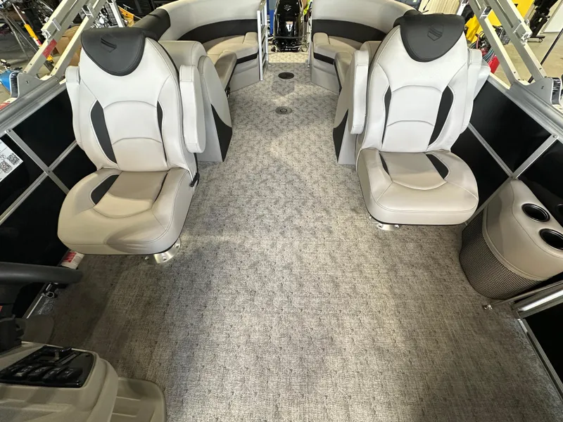 Slide: The Image of 2024 South Bay 224RSLE pontoon boat interior with plush seating and modern design. - 8