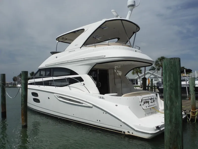 Slide: The Image of 2014 Meridian 441 Sedan yacht docked at marina. - 0