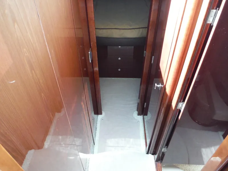 Slide: The Image of 2014 Meridian 441 Sedan interior hallway with wooden doors and carpeted floor. - 10