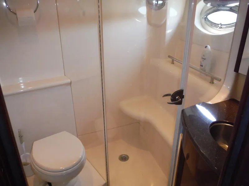Slide: The Image of 2014 Meridian 441 Sedan yacht bathroom with shower, toilet, and sink. - 16